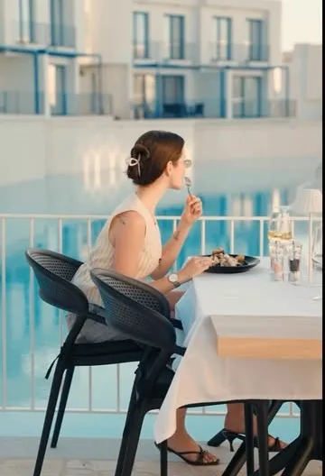 Guest enjoying dinner on a Mediterranean restaurant terrace in Lapta